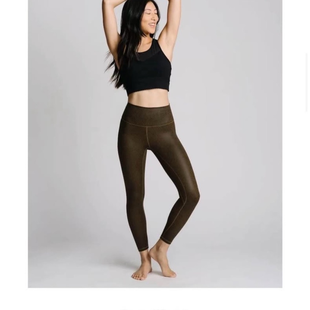 Crackled leather like leggings. Brownish in color. 3/4 length. New without tags